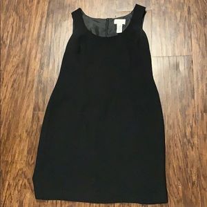 Black shift dress with a small slit in the back